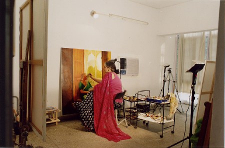 The artist in her workshop while painting The artist in her workshop while painting